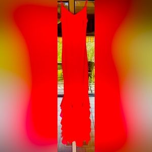 Long spaghetti strap dress with small ruffle layering at the bottom